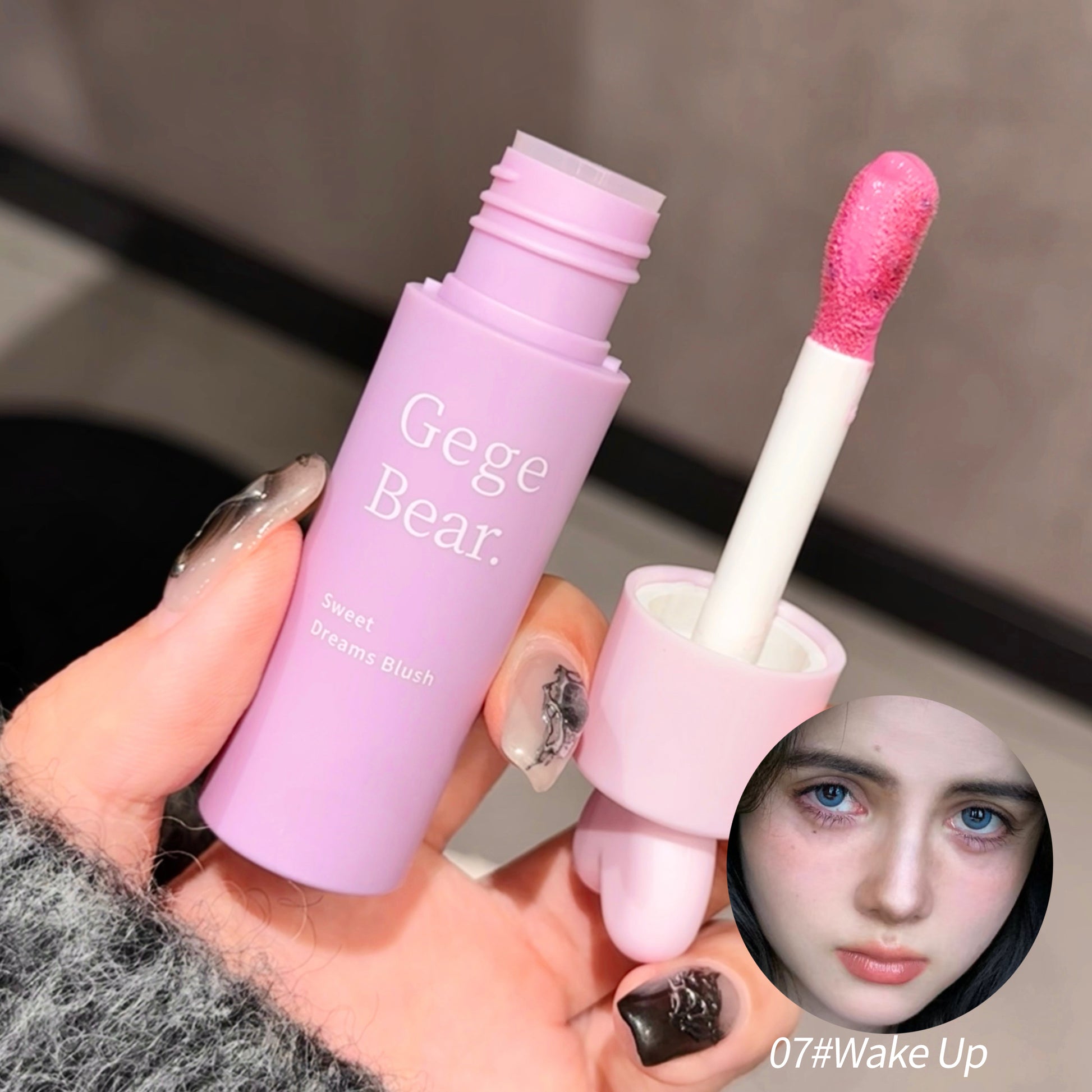 Purple lip gloss with pink applicator held by a hand, brand 'Gege Bear' visible.