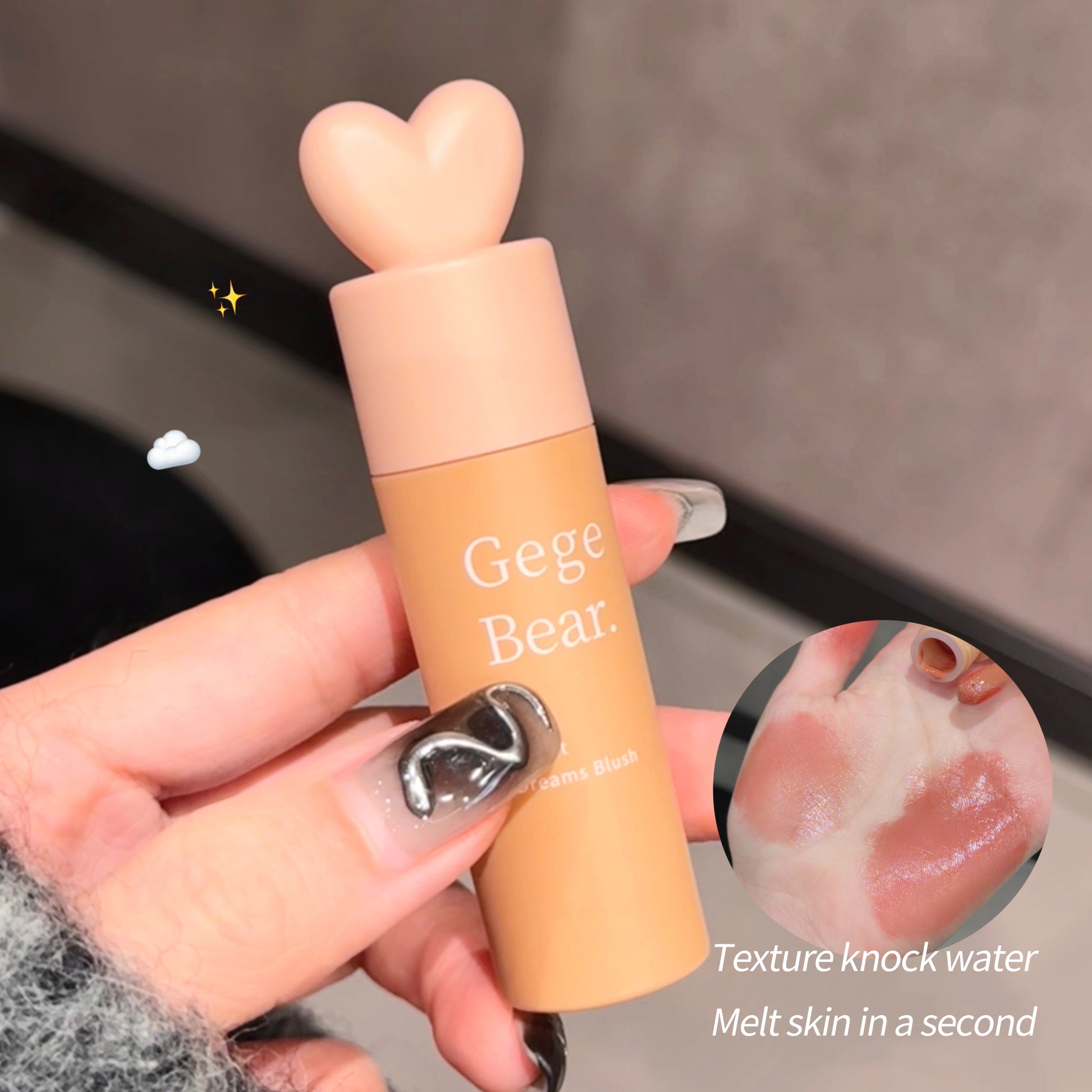 Hand holding a cosmetic product with 'Gege Bear' branding, showing texture and application on skin.