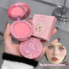 Pink blush compact and packaging held by a hand on a reflective surface.