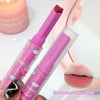 Pink lip gloss with cloud designs held by a hand, close-up of lips with gloss applied, and pink background.