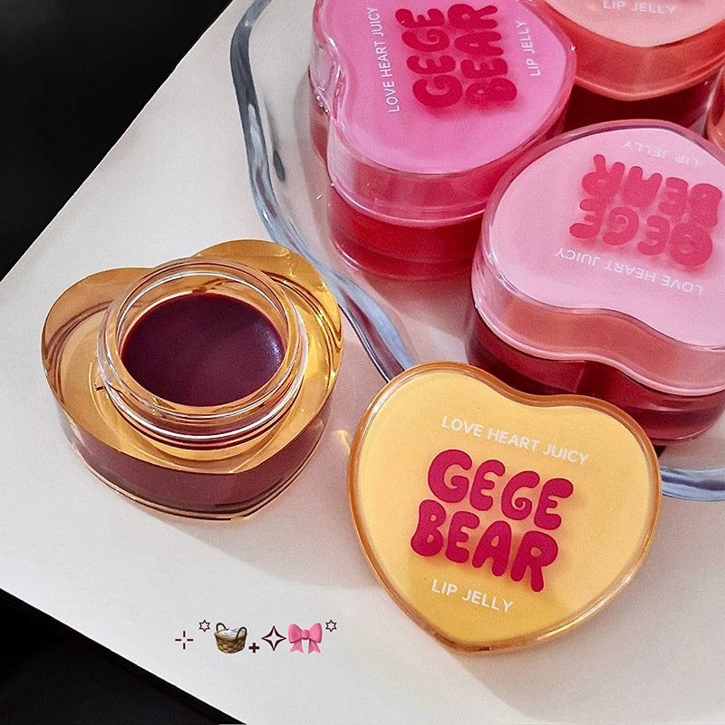 Heart-shaped GEGE BEAR lip jelly containers on a white surface