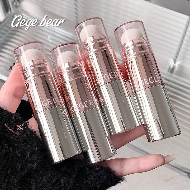 Four Gege Bear lip products held in a hand with a blurred background