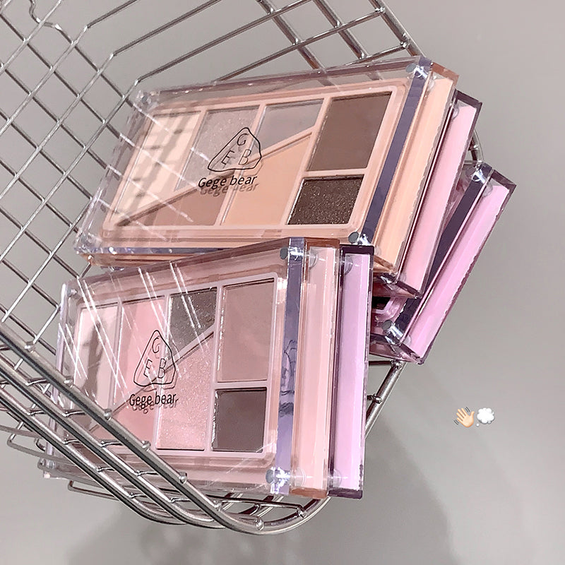 Makeup palette with a clear cover on a metal grid background