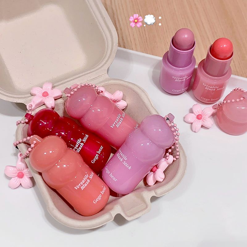 Pink lip balm set with decorative elements on a light background