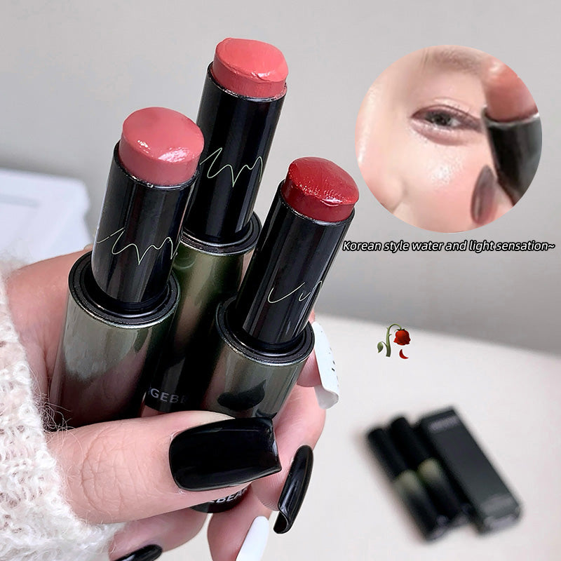 Hand holding four lipsticks with close-up of a lip and text overlay on a blurred background