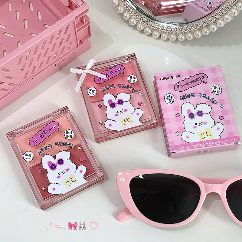 Three pink boxes with cartoon character designs and a pair of pink sunglasses on a white background.