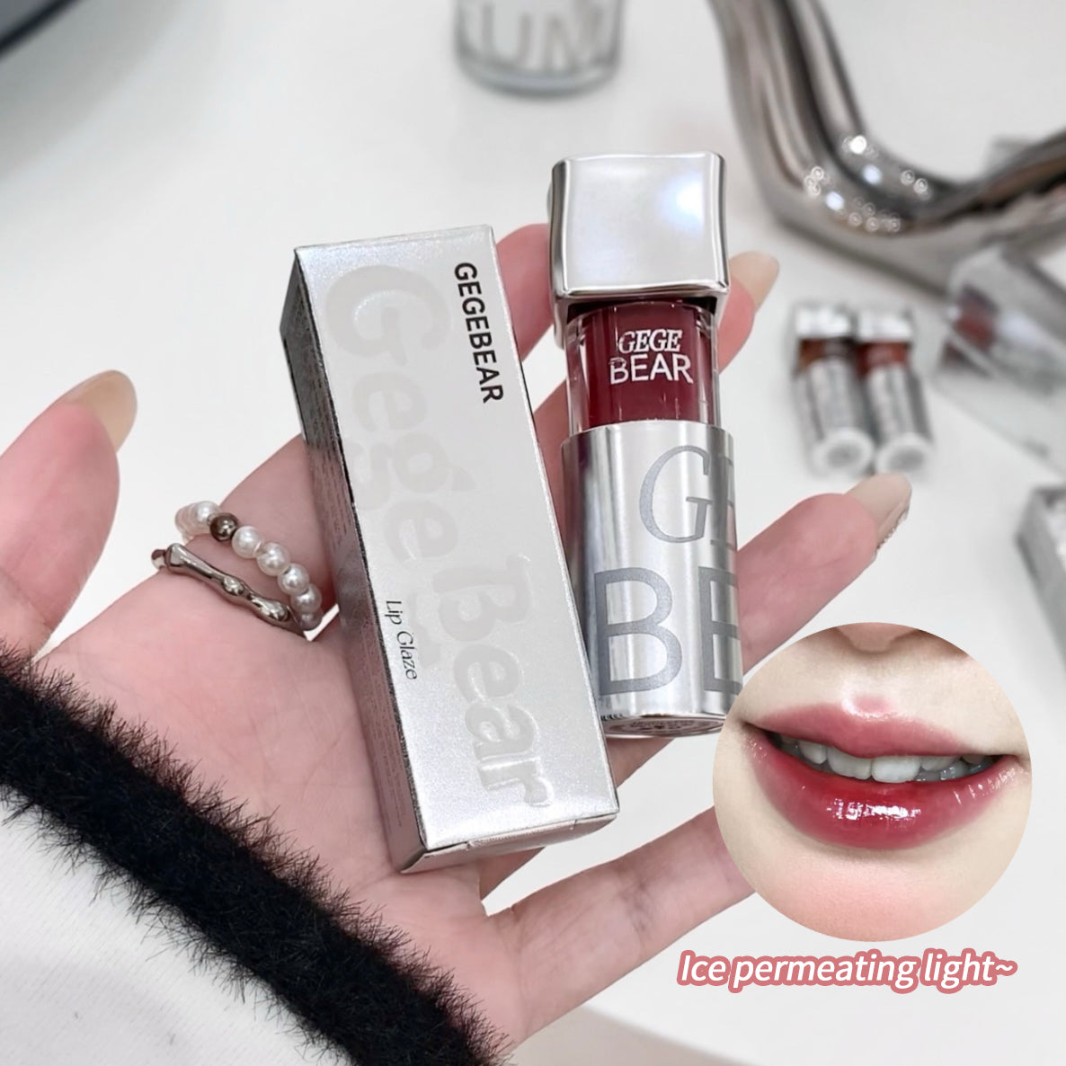 Hand holding a GEGEBEAR lip gloss with close-up of lips wearing the product.