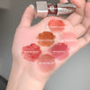 Lipstick shades swatched on a hand with brand name visible