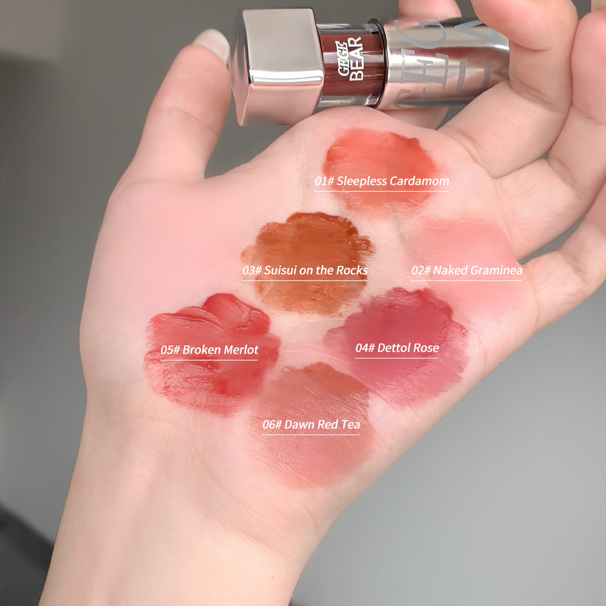 Lipstick shades swatched on a hand with brand name visible