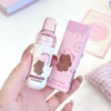 Hand holding a GEGER BEAR product with packaging on a light background