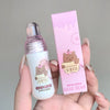 Small bottle and pink packaging with 'GEGE BEAR' design held by a hand against a gray background.
