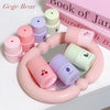 Set of small containers with lids on a pink stand, with 'Gege Bear' branding.