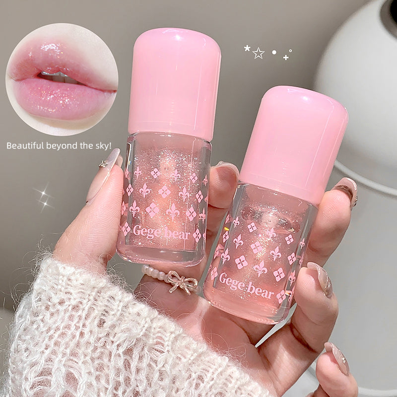 Two pink nail polishes with 'Gege bear' branding held by a person, with a close-up of pink lips.