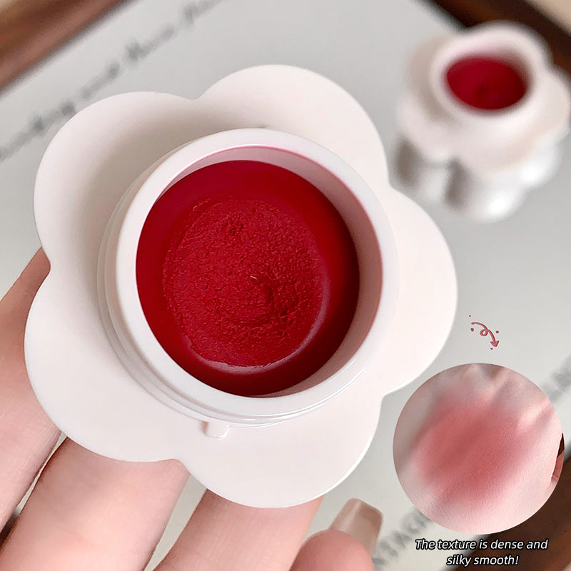 Red lipstick in a white container held by a hand, with close-up shots of the texture.