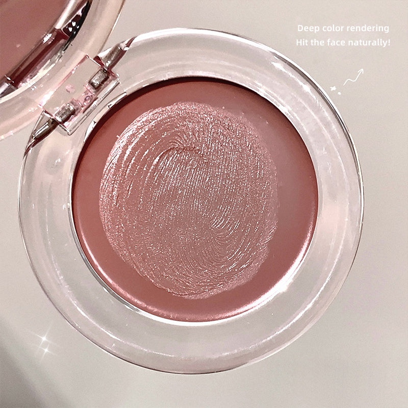 Compact blush with a pink shade on a white background