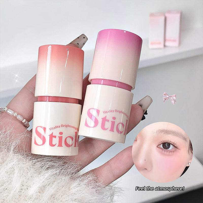 Two skincare products with 'Stick' branding held by a hand, with a blurred face in the corner.