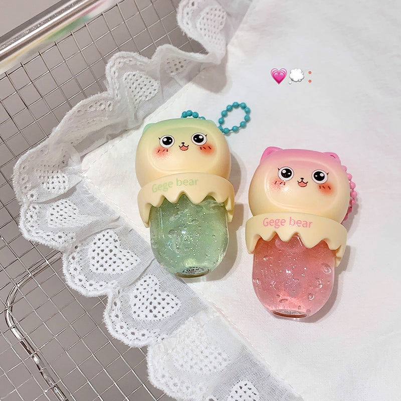 Two cute, cartoon-style hand sanitizers with a lace doily and tiled background.