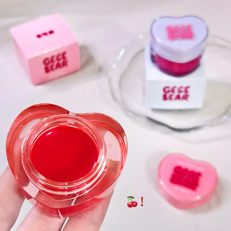 Heart-shaped red gel container with pink 'Gee Bear' logo on a white background