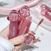 Pink lip gloss with applicator held by a hand, brand 'CECIBEAR' visible