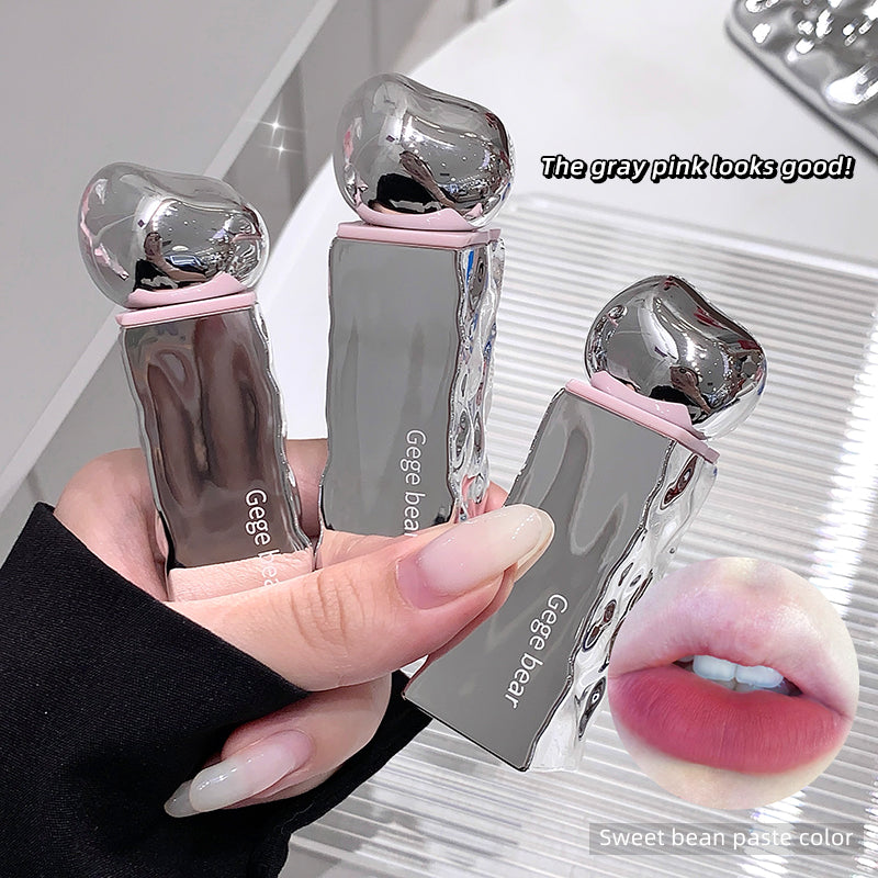 Three gray pink lip products held by a hand, with a close-up of lips wearing the product on the right.