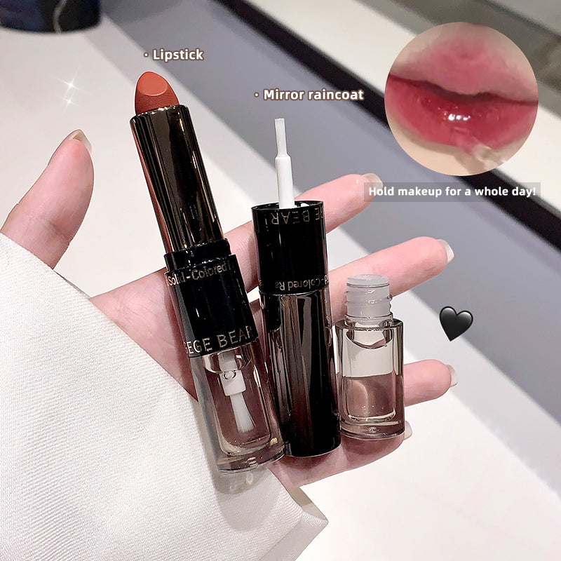 Hand holding three cosmetic products with close-up of lipstick on a white surface