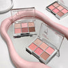 Makeup palettes with pink and brown shades on a white surface