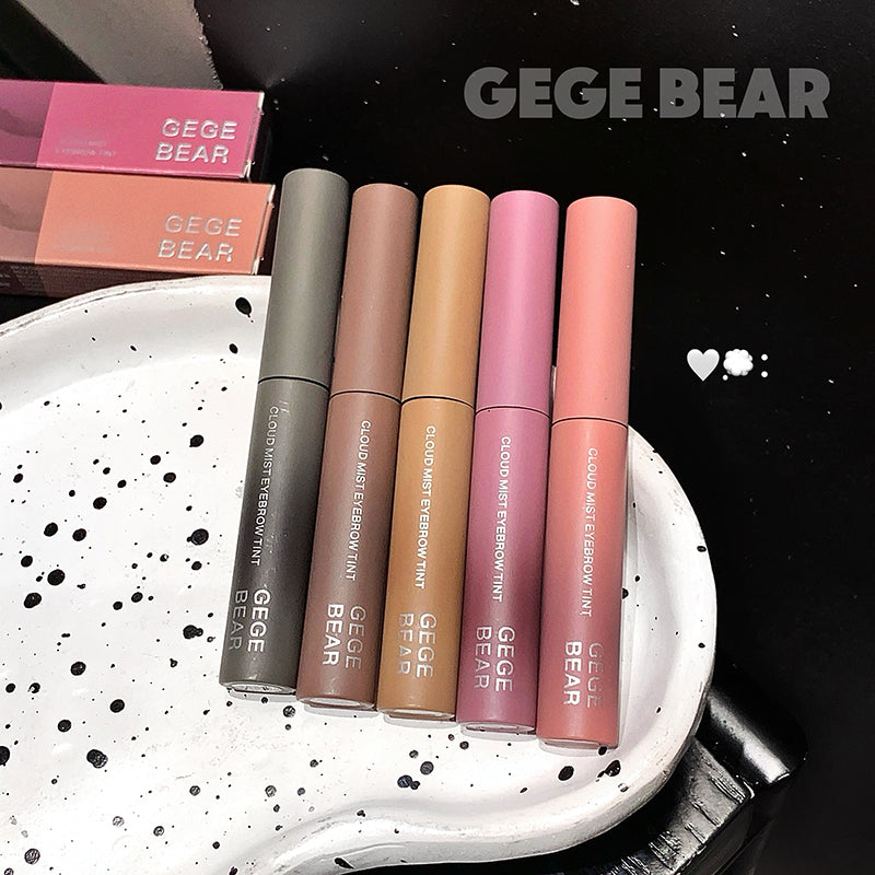 Five GEGE BEAR lip products on a white plate with black speckles, against a black background.
