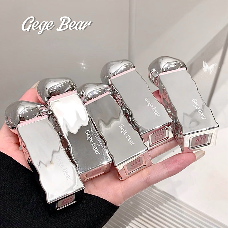 Hand holding multiple silver and pink 'Gege Bear' products against a neutral background