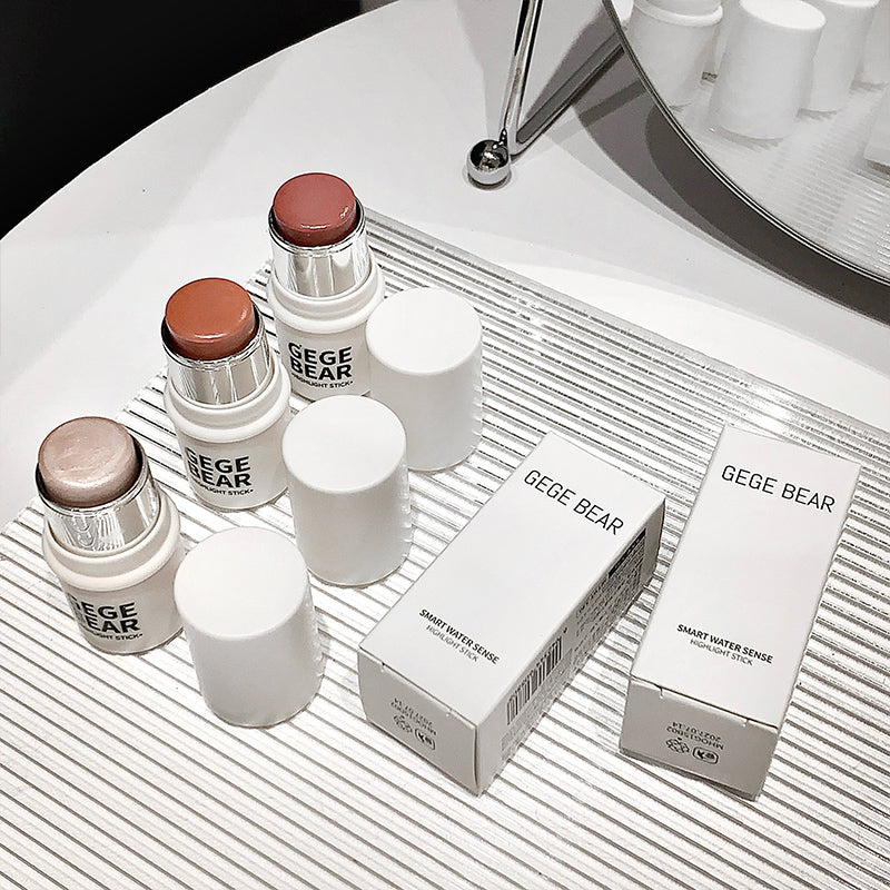 Cosmetic products and boxes with 'GEGE BEAR' branding on a white surface.