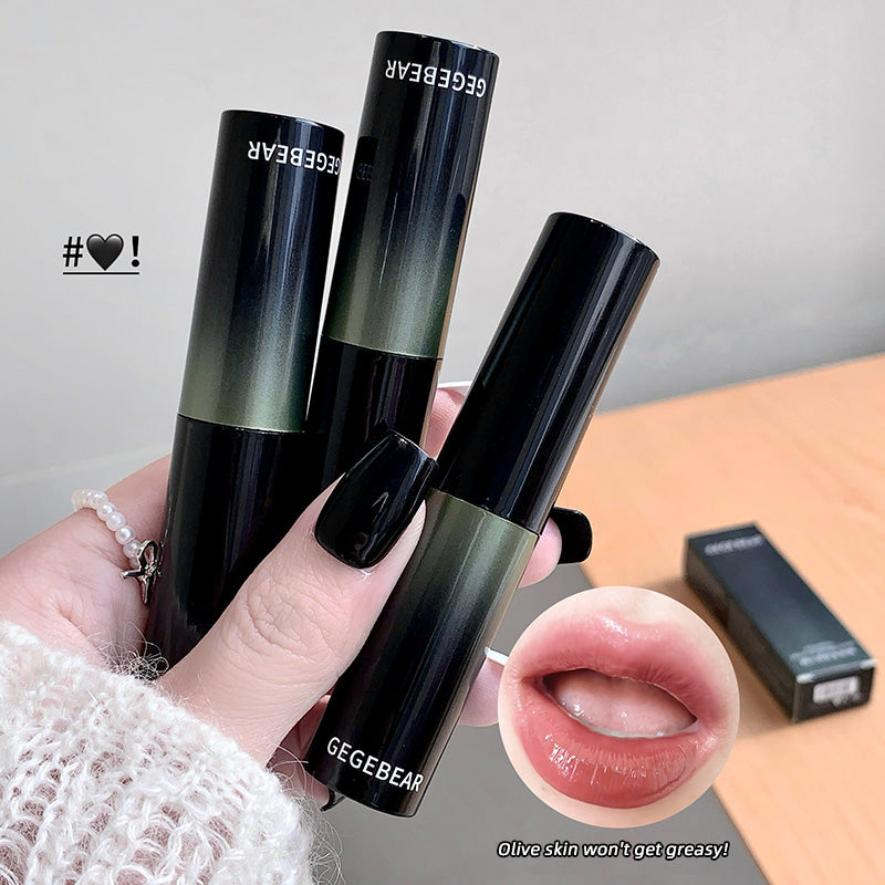 Three black lip products with 'GEGEBEAR' branding held by a hand, with a close-up of a lip and text on a gray background.