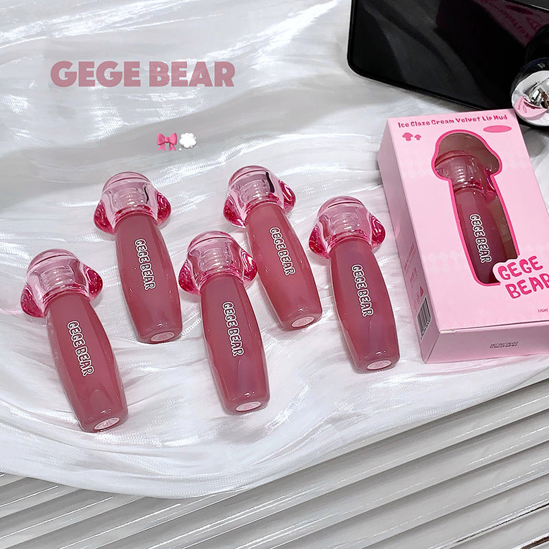Pink lip gloss with 'GEGE BEAR' branding on a white surface.