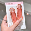 Hand holding a pink bottle with packaging labeled 'user_name' from China