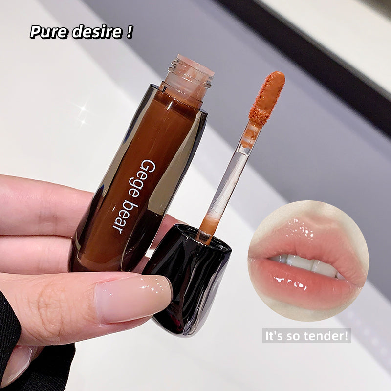Lip gloss with applicator and close-up of lips wearing the product, labeled 'pure desire' and 'it's so tender'.