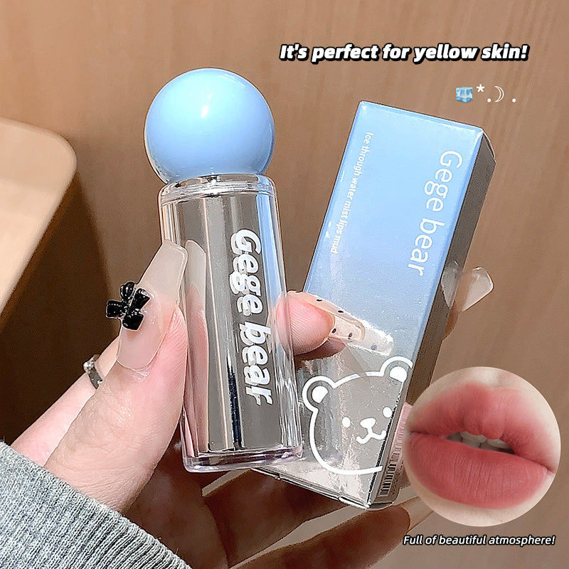 Clear cosmetic bottle with blue cap held by a hand, Gege Bear branding visible.