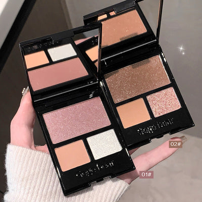 Makeup palette with various shades held by a hand