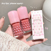 Two pink lip products with a Gege bear box held in a hand against a neutral background.