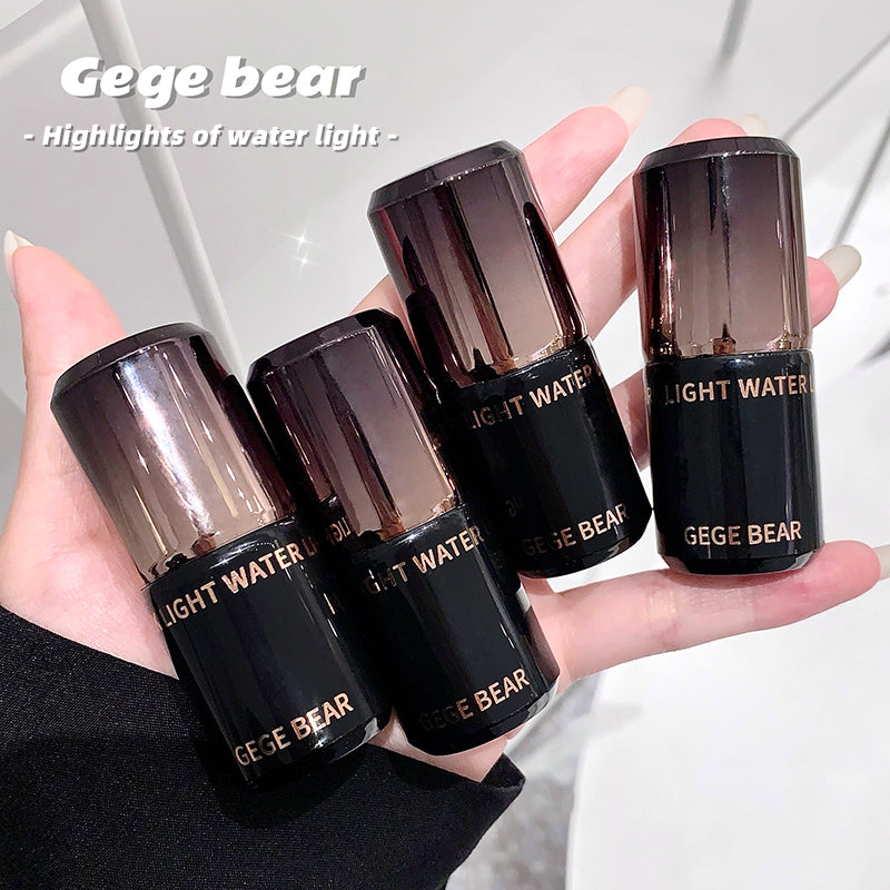 Five black Gege Bear lip products held in a hand against a light background