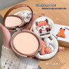 Compact powder with fox design on a wooden surface