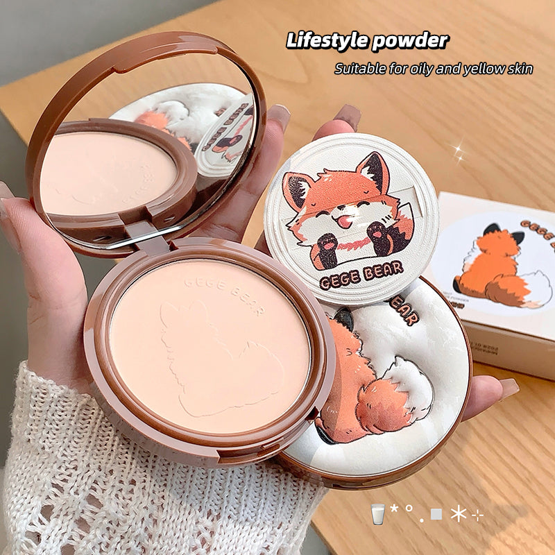 Compact powder with fox design on a wooden surface