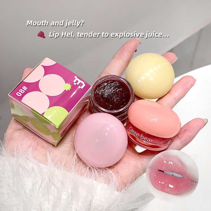 Hand holding lip balm and packaging with text overlay