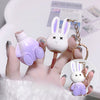Lipstick with rabbit design holder and keychain on a blurred background