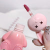 Pink lip gloss with a cute animal design on a white background