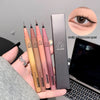 Set of makeup pencils with a box, displayed on a hand with a laptop in the background.