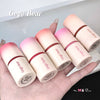 Set of Gege Bear lip balms on a hand with a white background
