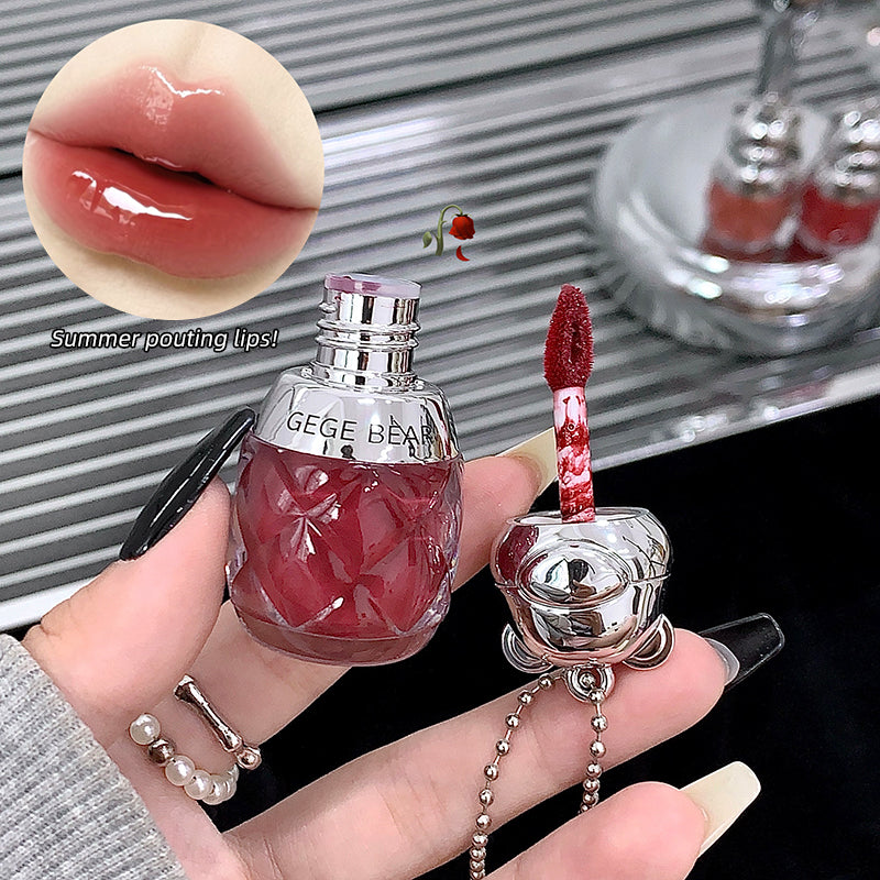 Lip gloss with rose-shaped applicator held by a hand, close-up of lips with text 'Summer pouting lips!'.