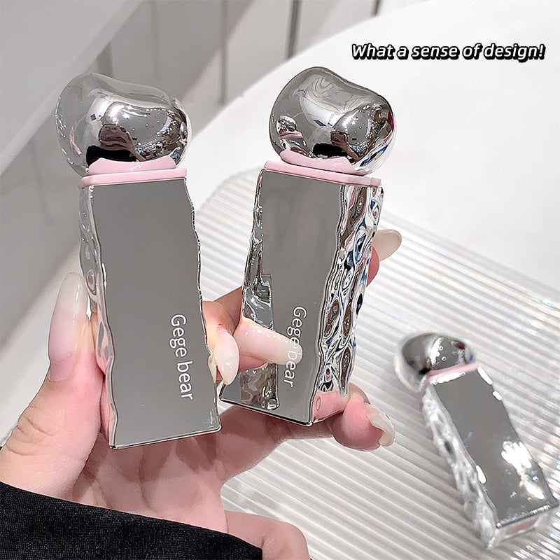 Silver and pink phone case with 'Gee bear' branding held by a hand against a white background.