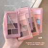 Makeup eyeshadow palettes with pink cases held by a hand