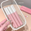 Pink lip glosses with white caps in a white mesh basket, brand 'Gege bear' visible.