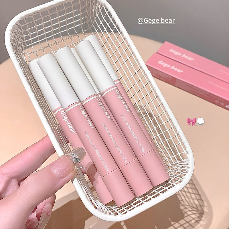 Pink lip glosses with white caps in a white mesh basket, brand 'Gege bear' visible.