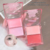 Two pink makeup products in open cases on a neutral background
